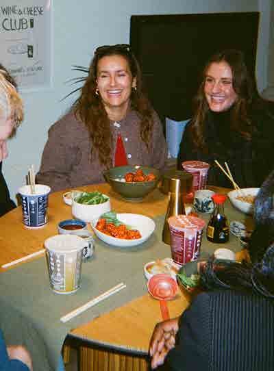 Students chatting over dinner at Alpha